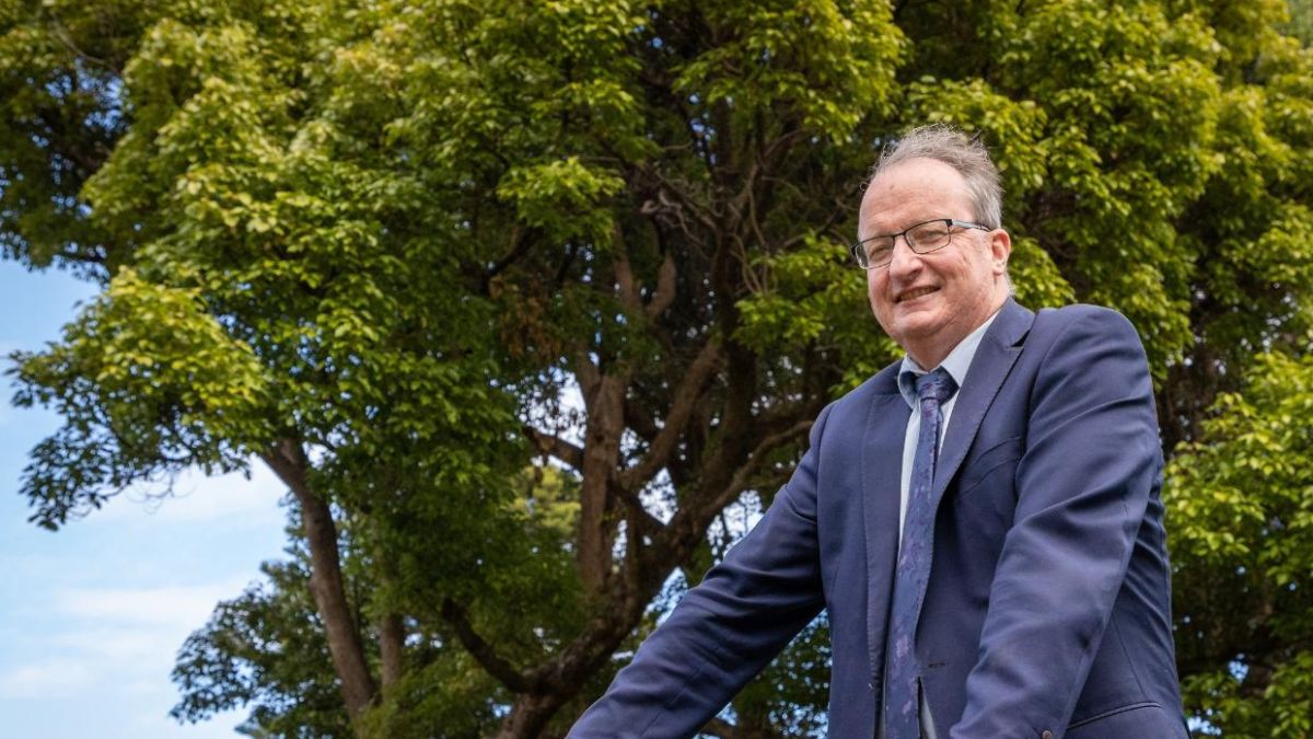 Lawyer Chris Nicholls bikes to work on leafy streets in Lower Hutt